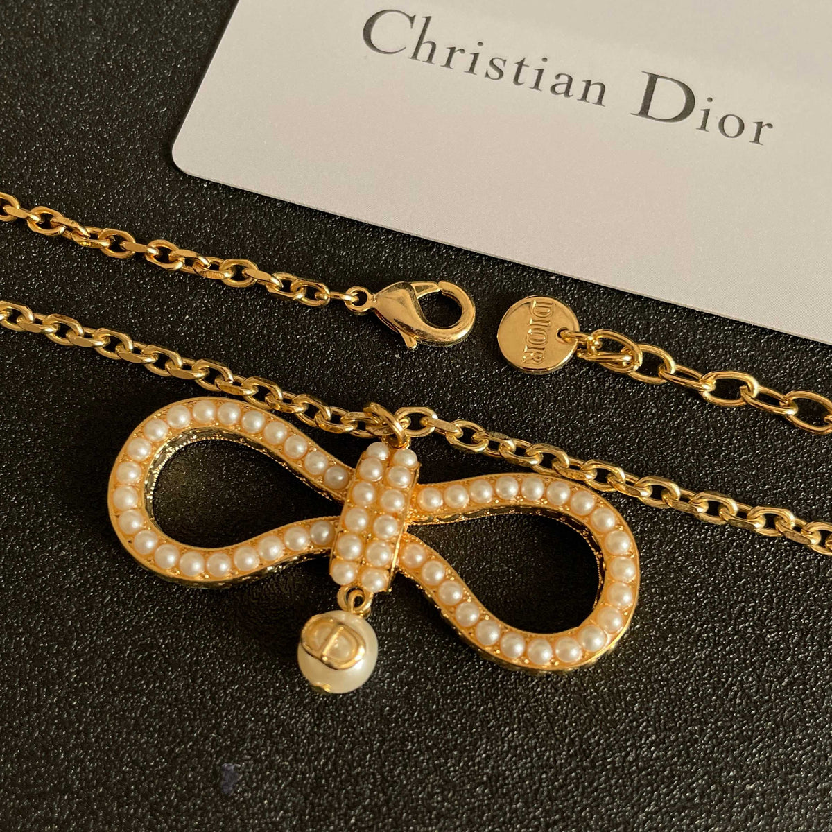 Martin Graham pendant necklace in polished metal-tone – close-up detail