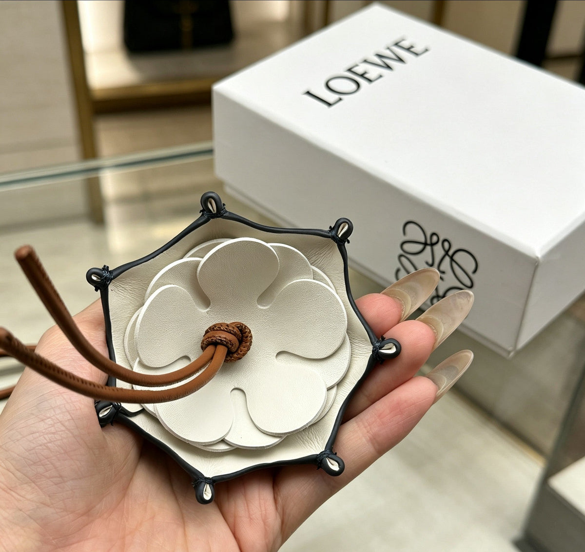 Martin Graham bag charm in polished metal-tone – close-up detail