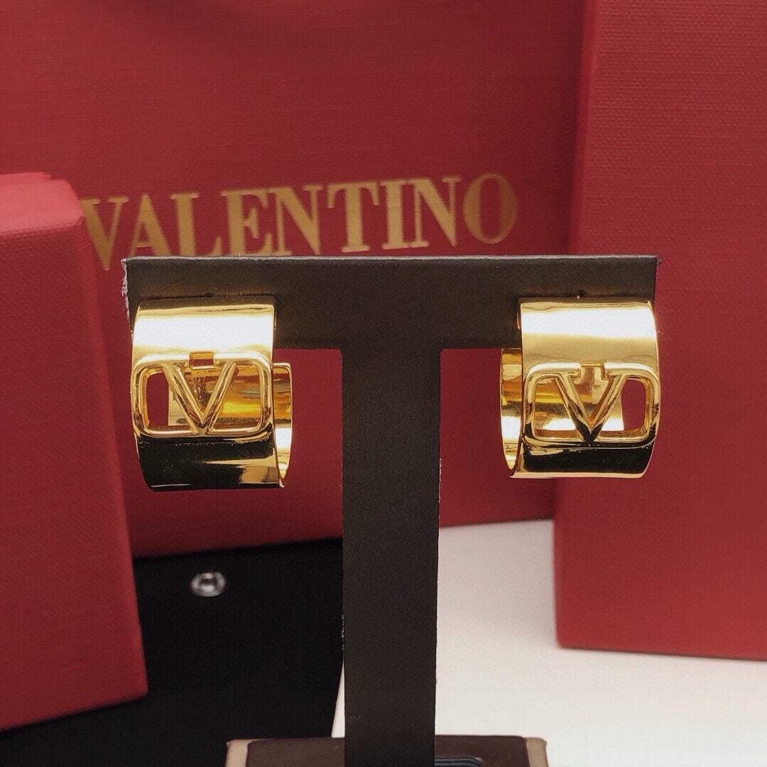 Martin Graham earrings in polished metal-tone
