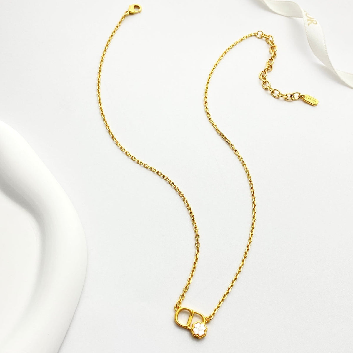 Martin Graham pendant necklace in polished metal-tone – close-up detail