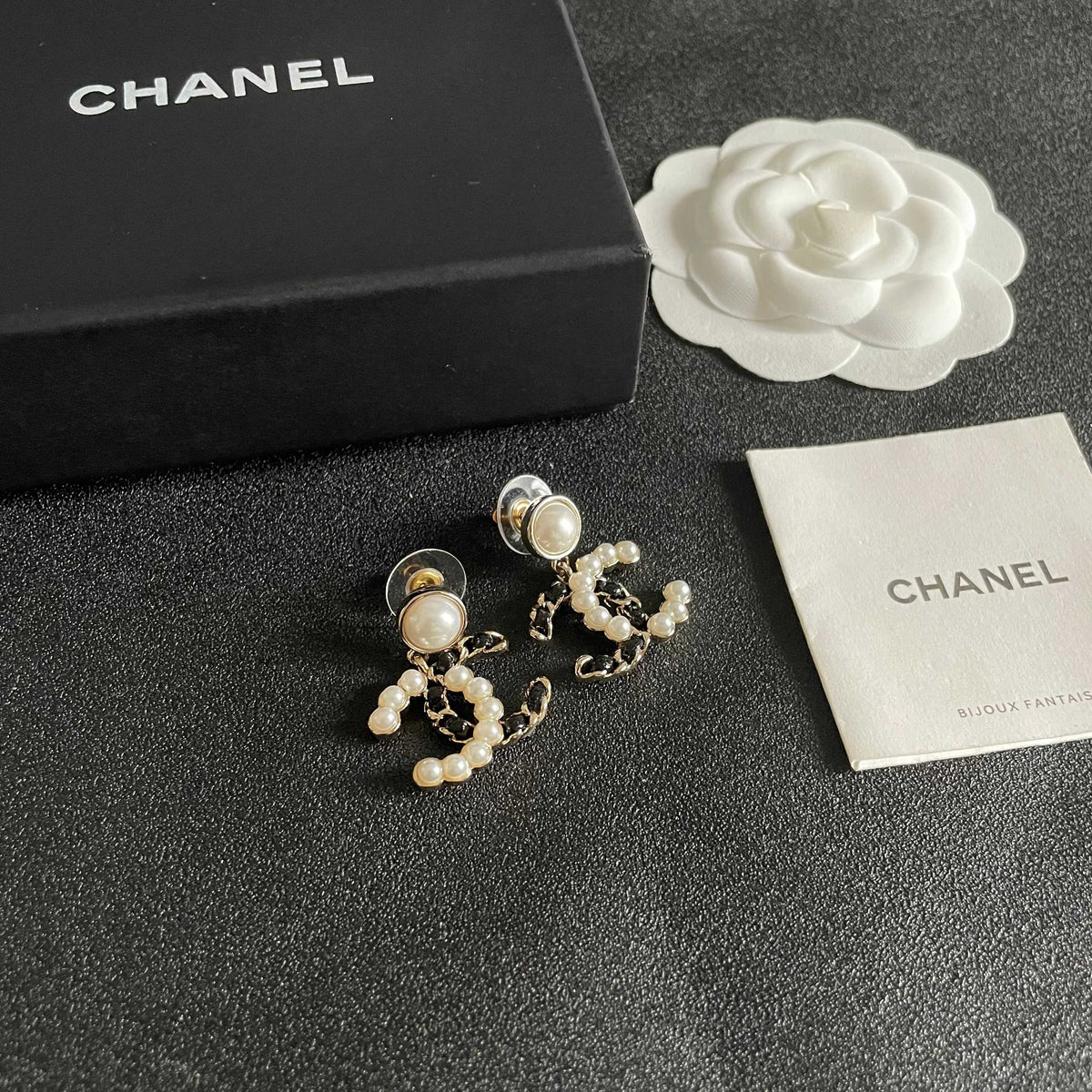 Martin Graham stud earrings in polished metal-tone – styled product view