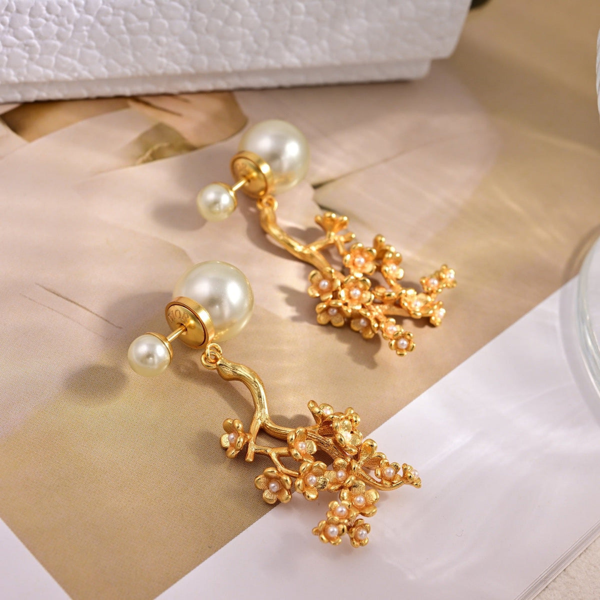 Martin Graham earrings in polished metal-tone – close-up detail