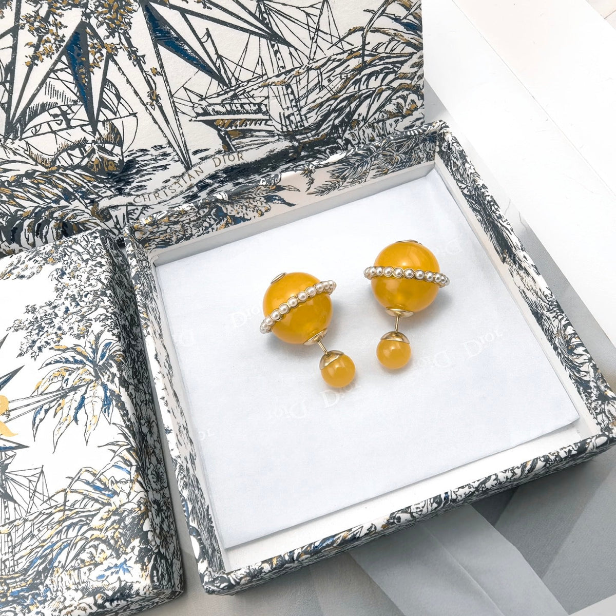 Martin Graham earrings in polished metal-tone – close-up detail