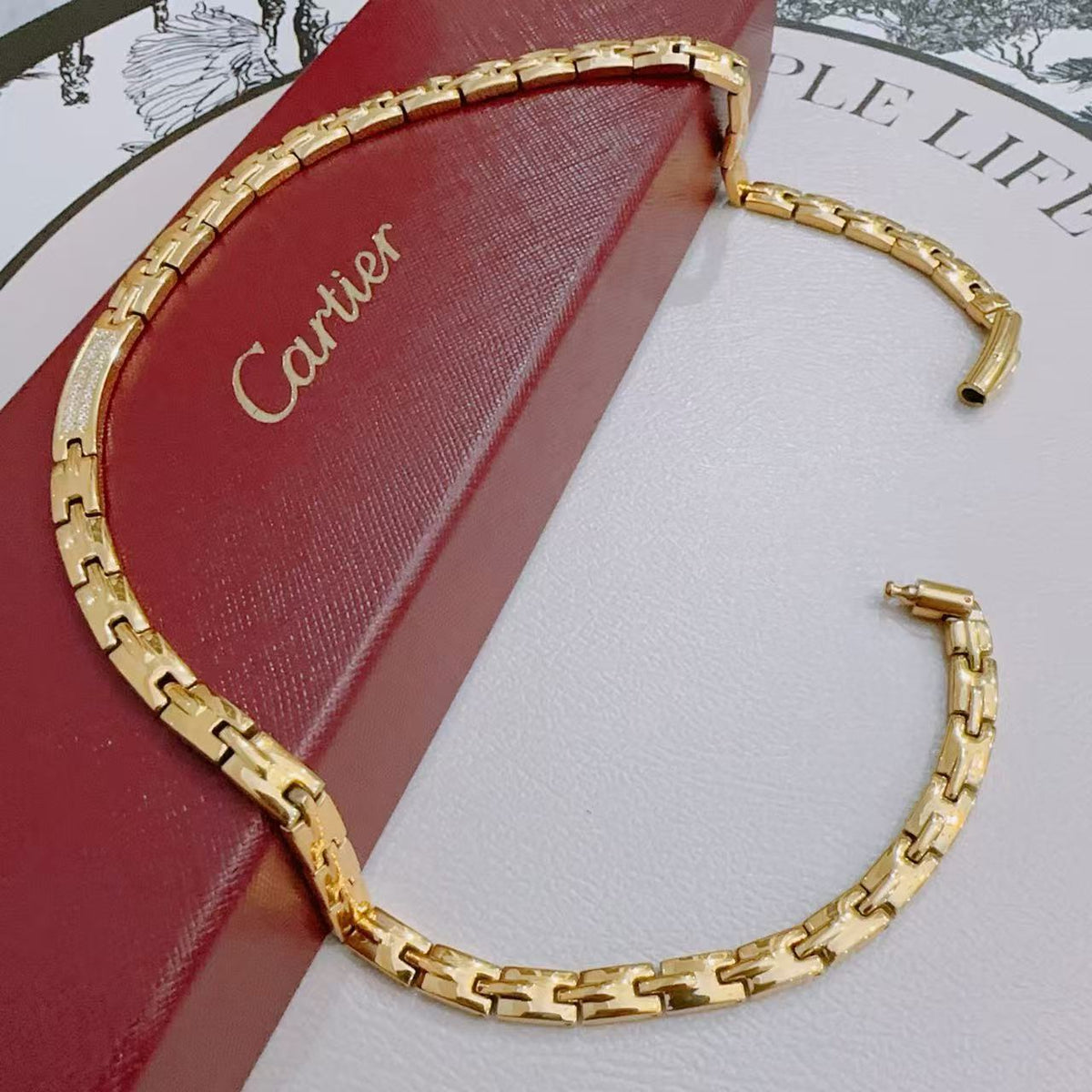 Martin Graham pendant necklace in polished metal-tone – close-up detail