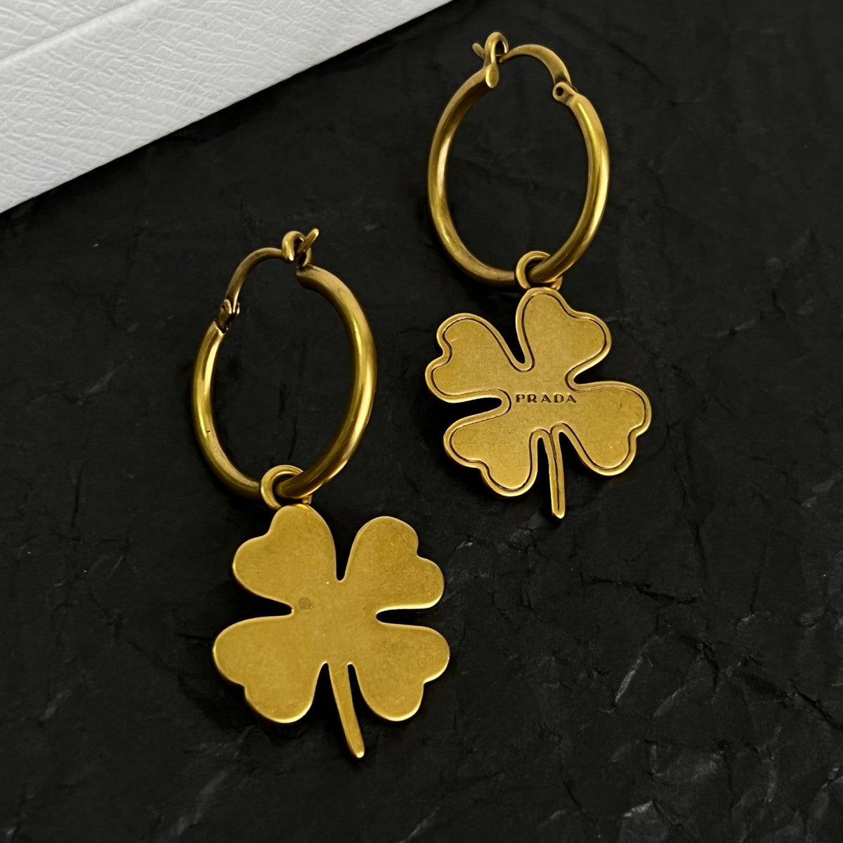Martin Graham earrings in polished metal-tone