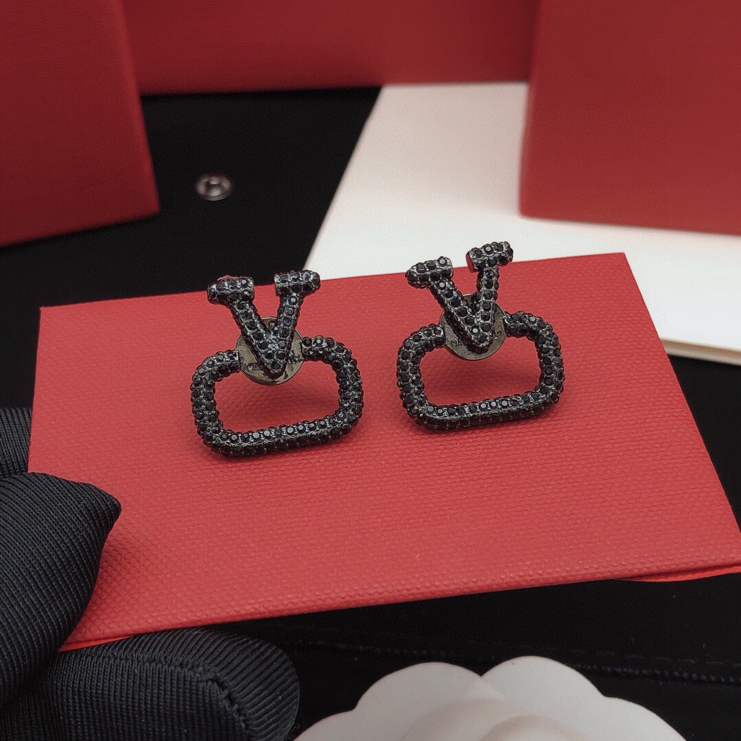 Martin Graham stud earrings in polished metal-tone