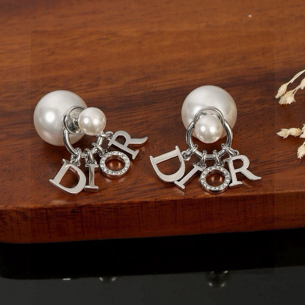 Martin Graham earrings in polished metal-tone – close-up detail
