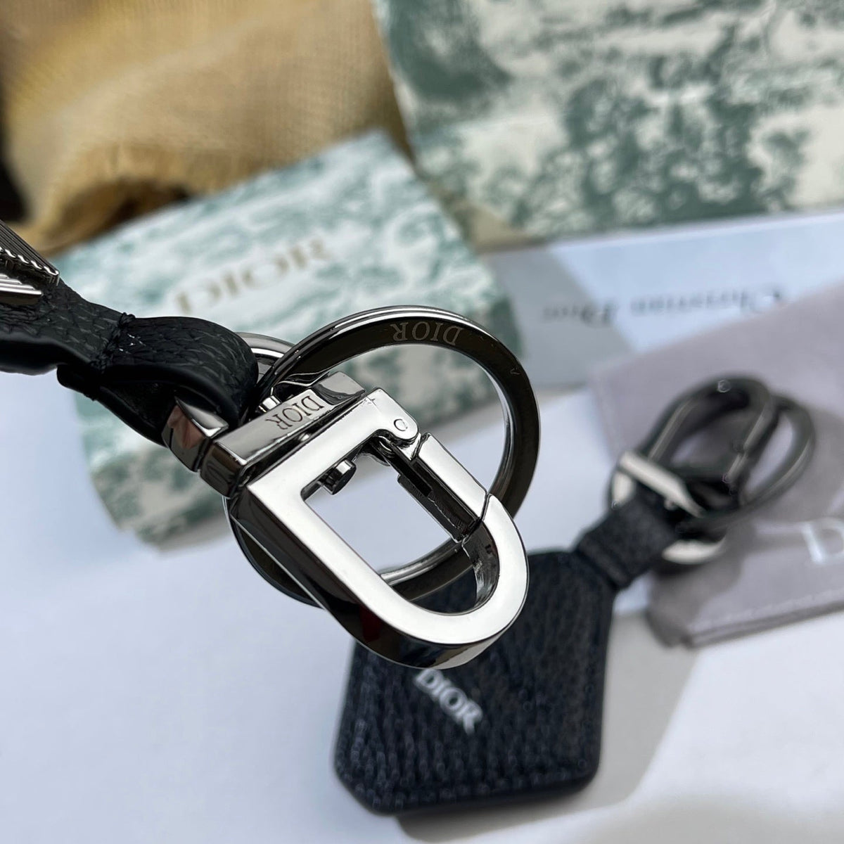 Martin Graham bag charm in polished metal-tone – close-up detail