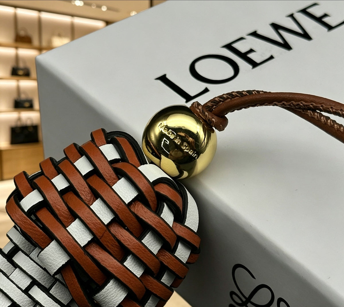 Martin Graham bag charm in polished metal-tone – close-up detail