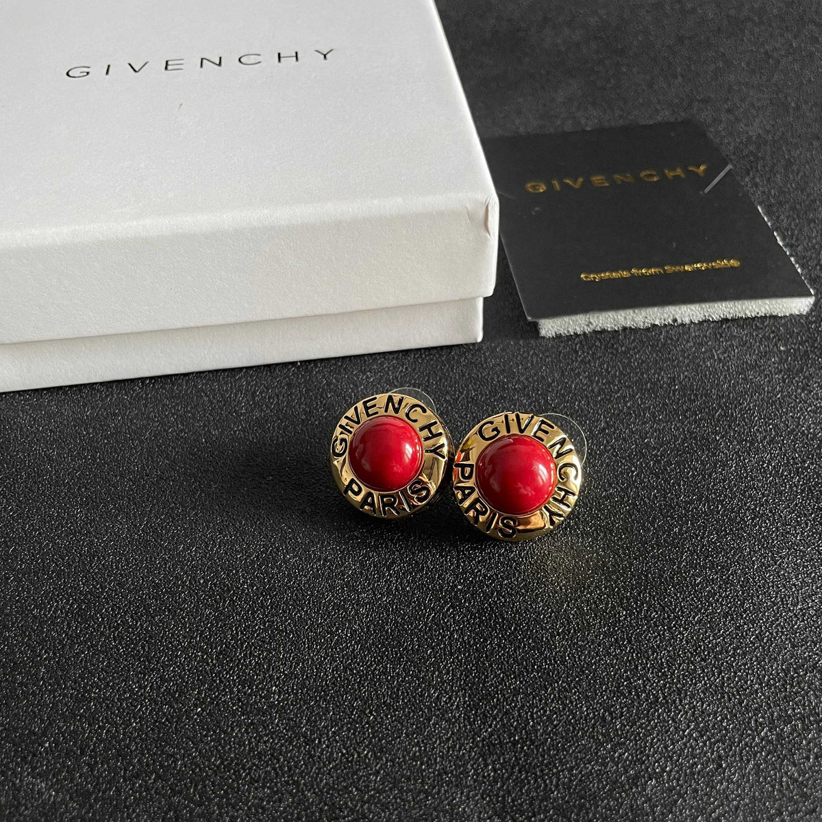 Martin Graham stud earrings in polished metal-tone
