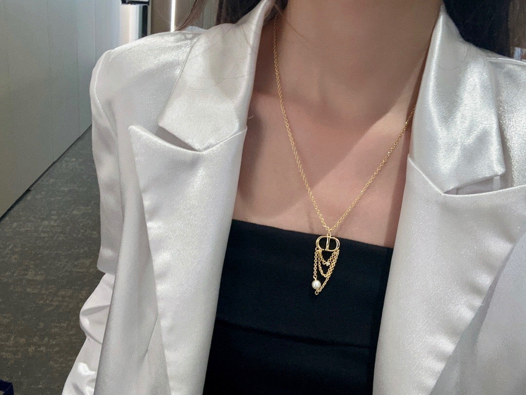 Martin Graham pendant necklace in polished metal-tone – close-up detail