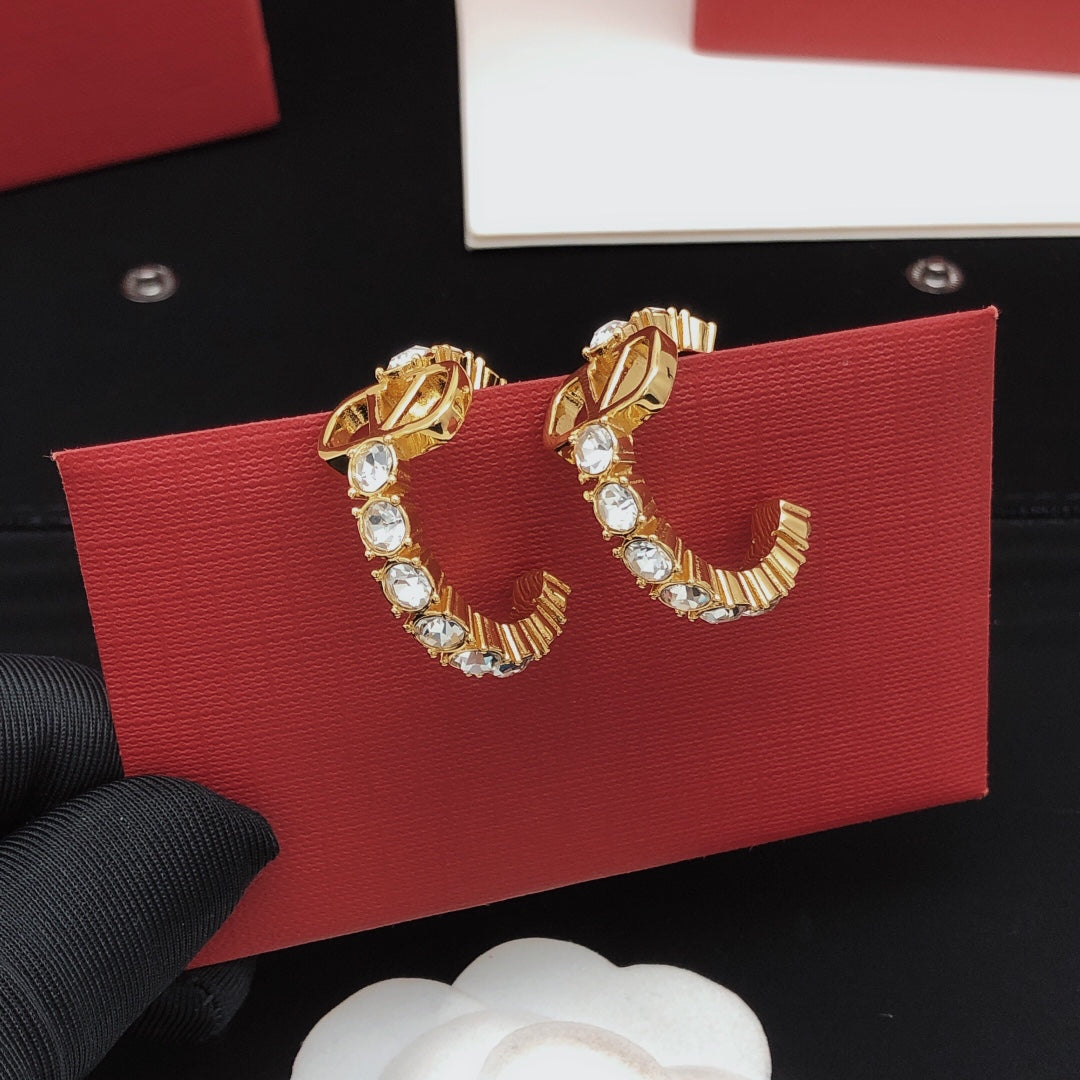 Martin Graham earrings in polished metal-tone