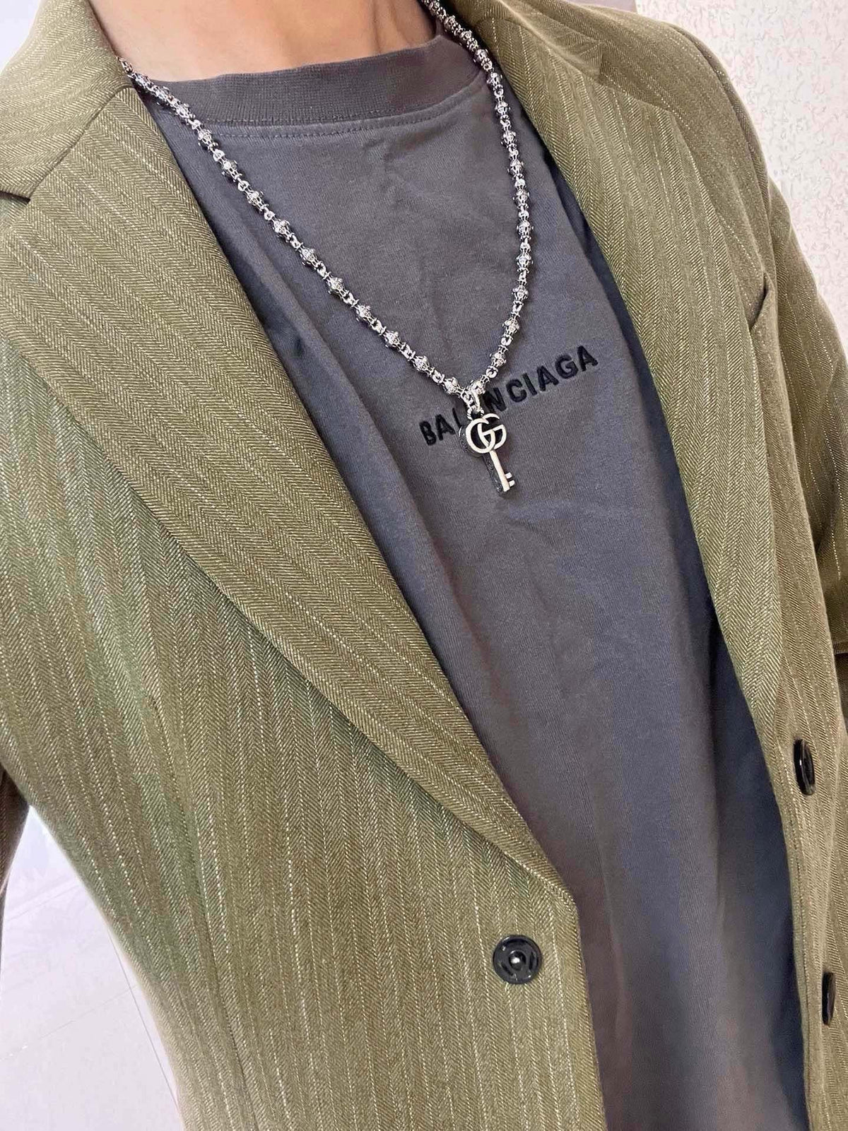 Martin Graham pendant necklace in polished metal-tone – styled product view