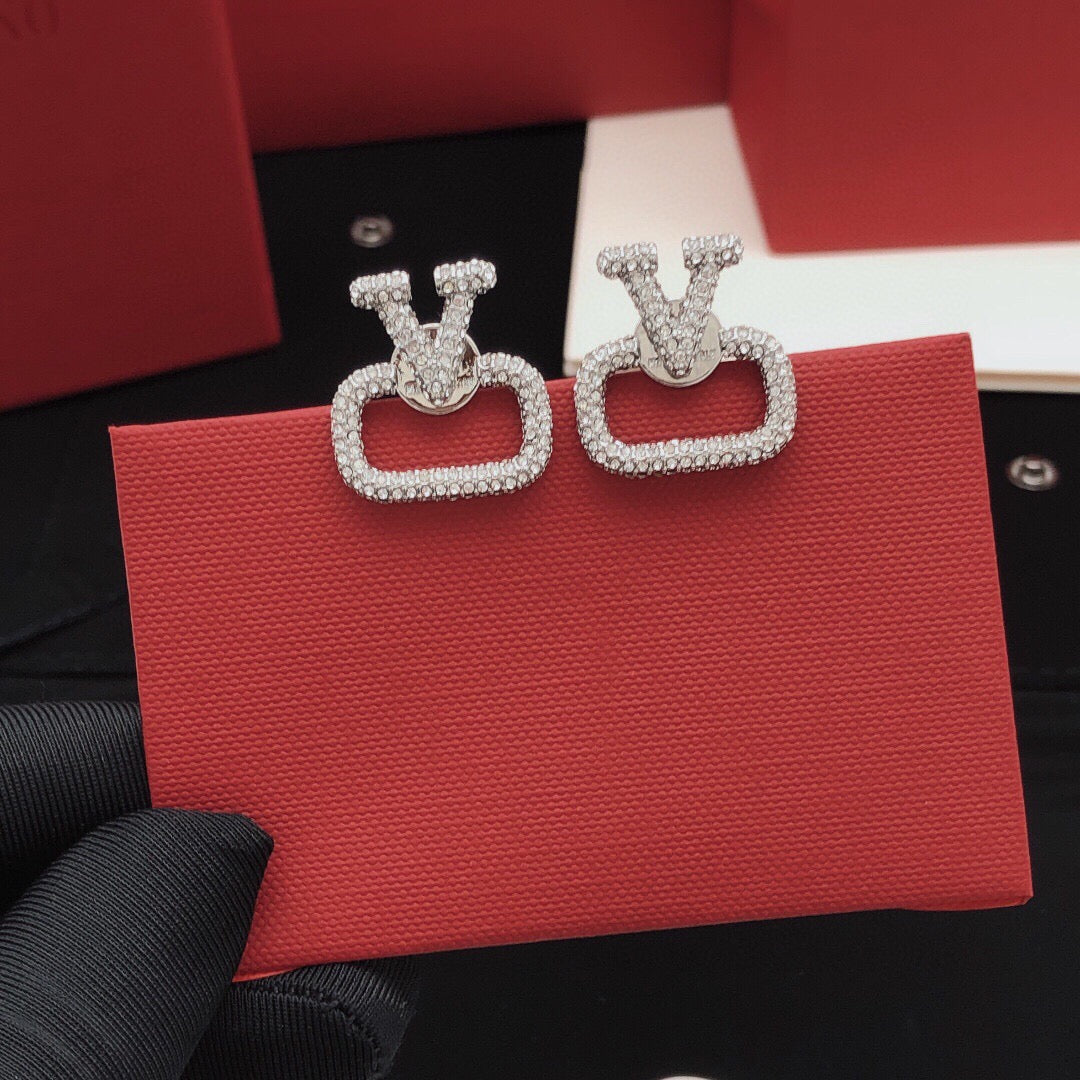 Martin Graham stud earrings in polished metal-tone