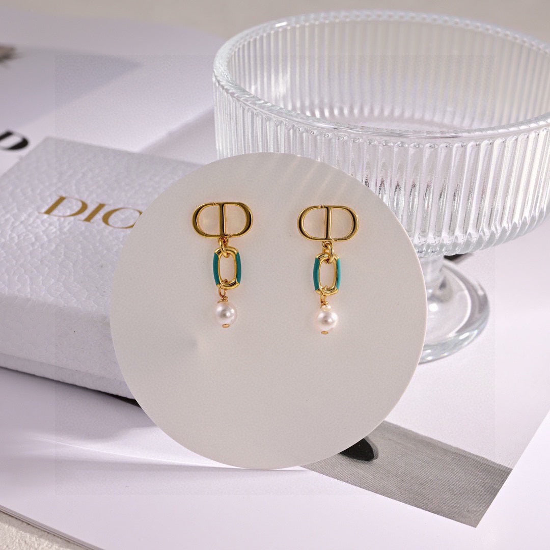 Martin Graham earrings in polished metal-tone – close-up detail