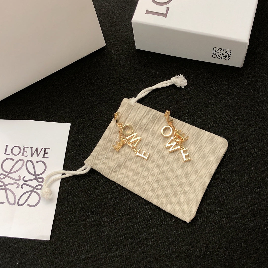 Martin Graham stud earrings in polished metal-tone – close-up detail