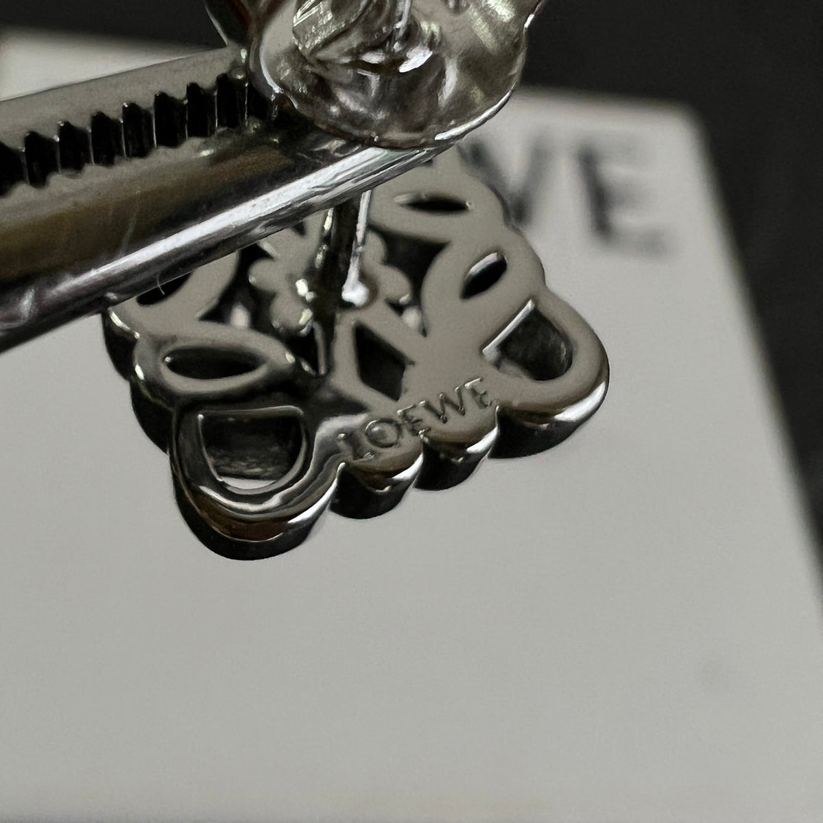 Martin Graham stud earrings in polished metal-tone – close-up detail
