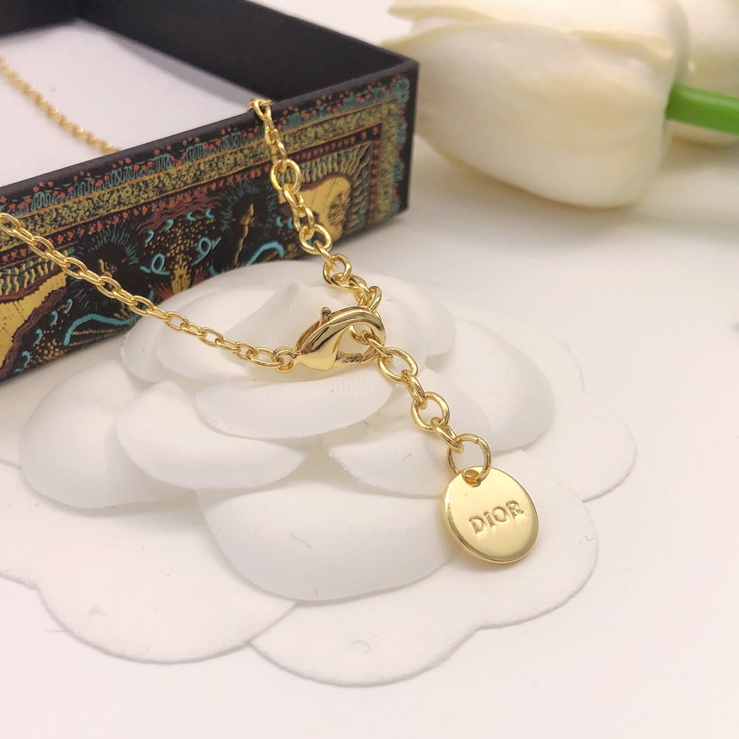 Martin Graham pendant necklace in polished metal-tone – close-up detail