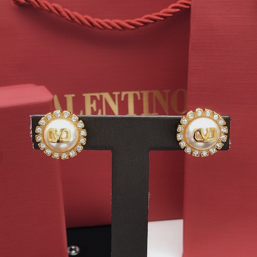 Martin Graham stud earrings in polished metal-tone