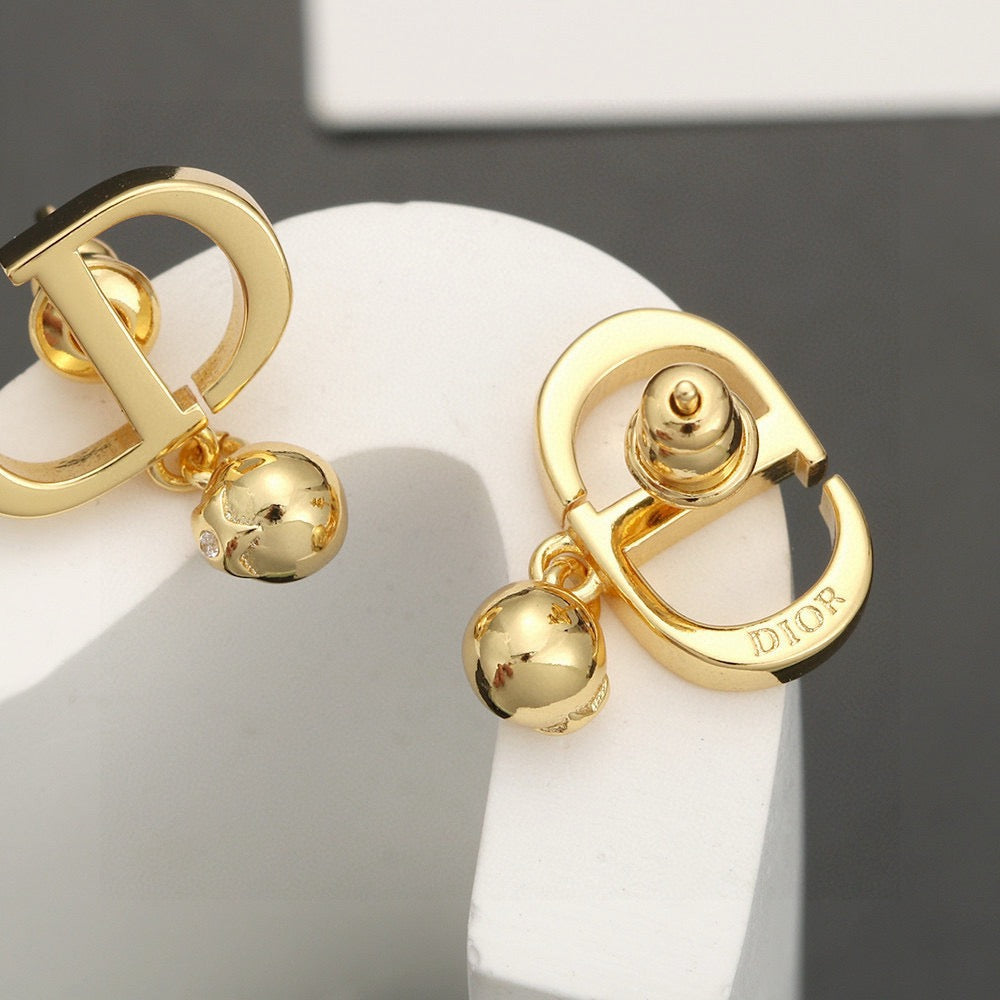 Martin Graham earrings in polished metal-tone – close-up detail