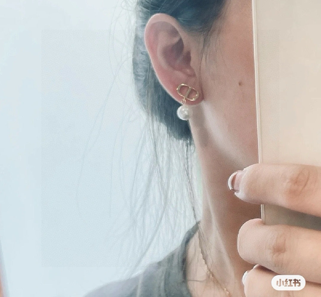 Martin Graham stud earrings in polished metal-tone – main product view