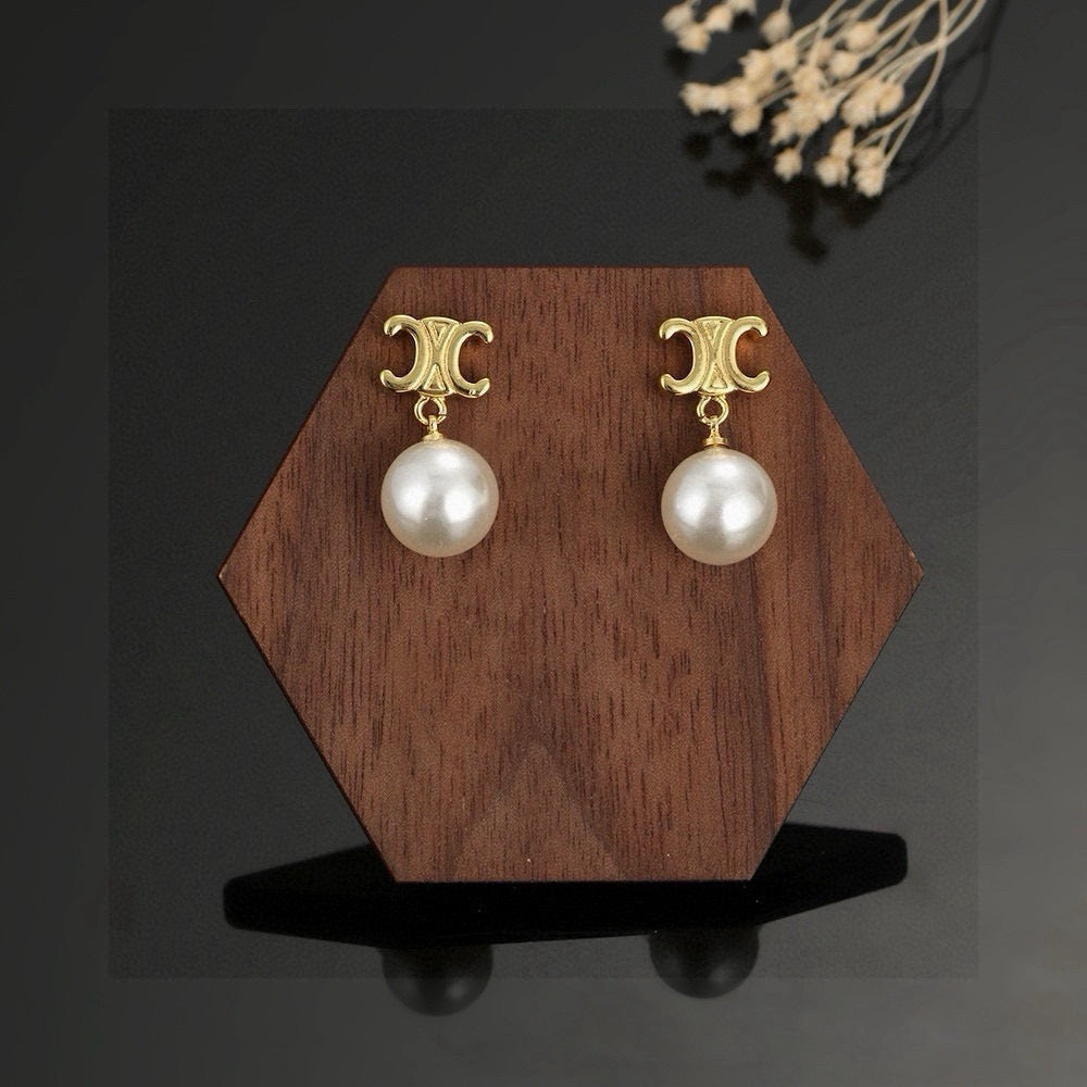 Martin Graham stud earrings in polished metal-tone – main product view