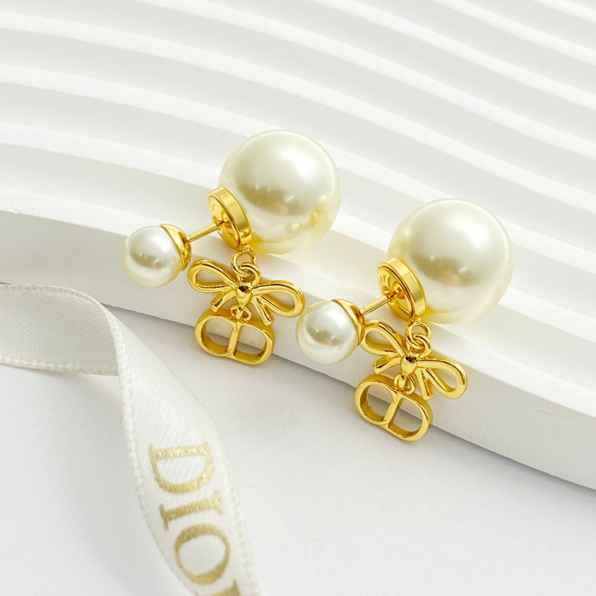 Martin Graham stud earrings in polished metal-tone – main product view