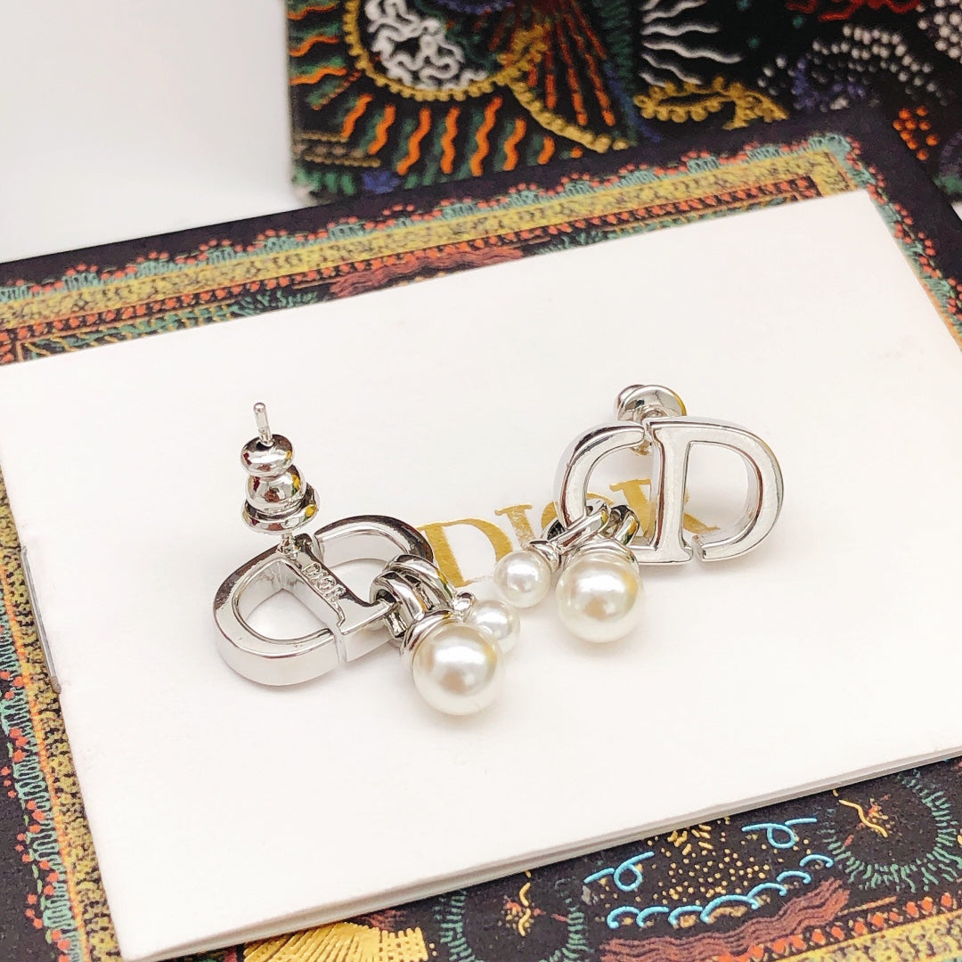 Martin Graham stud earrings in polished metal-tone – main product view