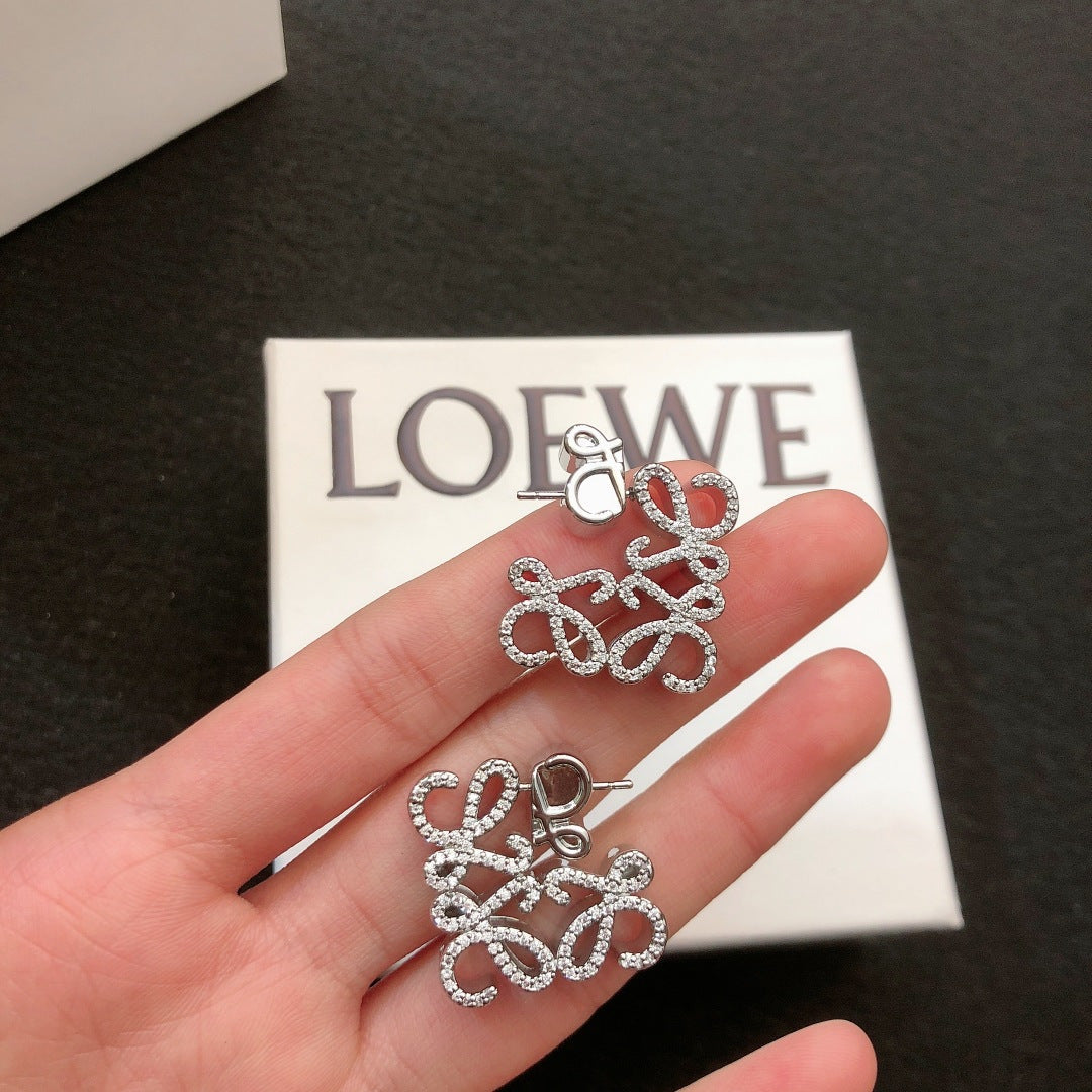 Martin Graham stud earrings in polished metal-tone – main product view
