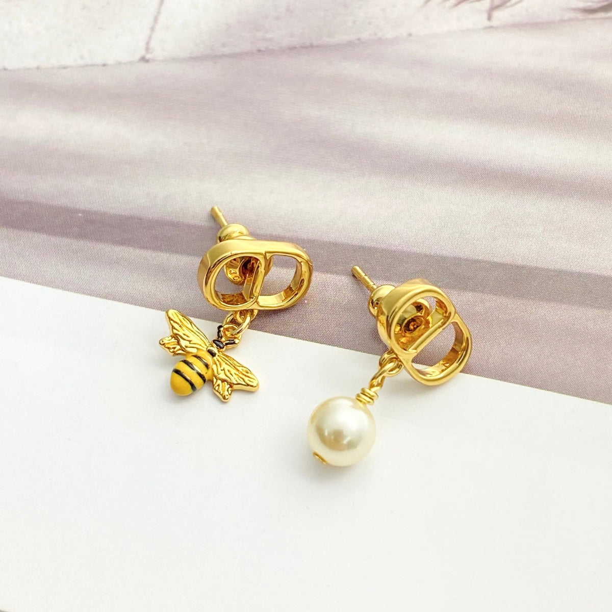 Martin Graham stud earrings in polished metal-tone – main product view