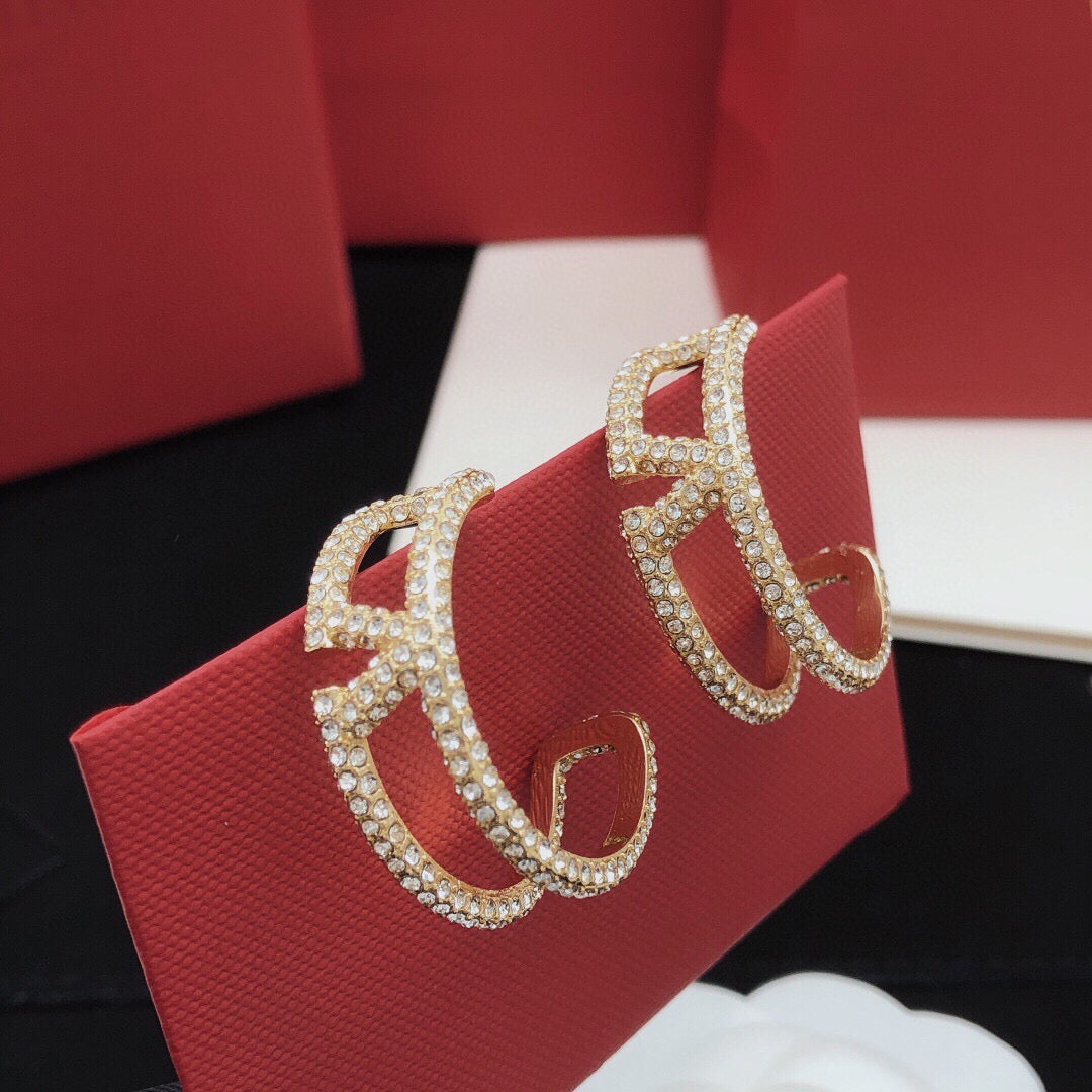 Martin Graham earrings in polished metal-tone – front view