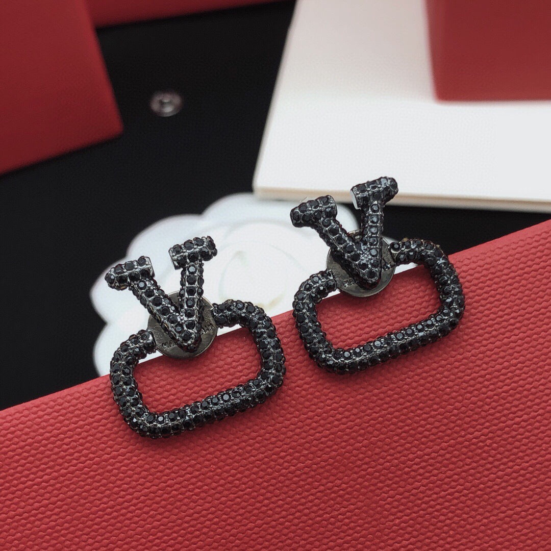Martin Graham stud earrings in polished metal-tone – front view