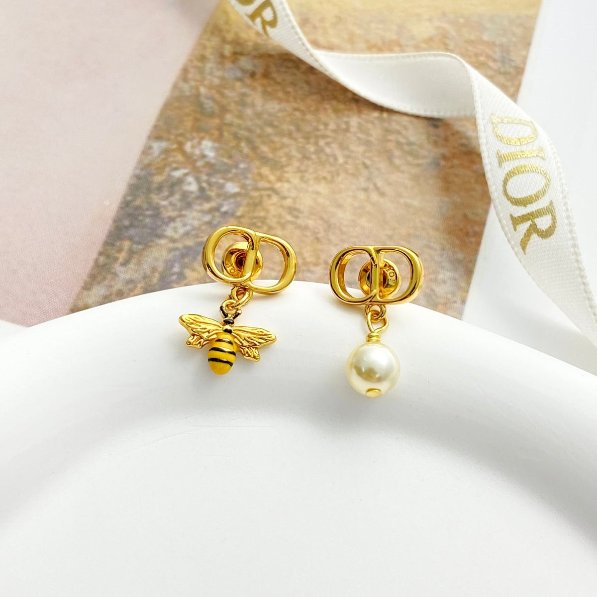 Martin Graham stud earrings in polished metal-tone – front view