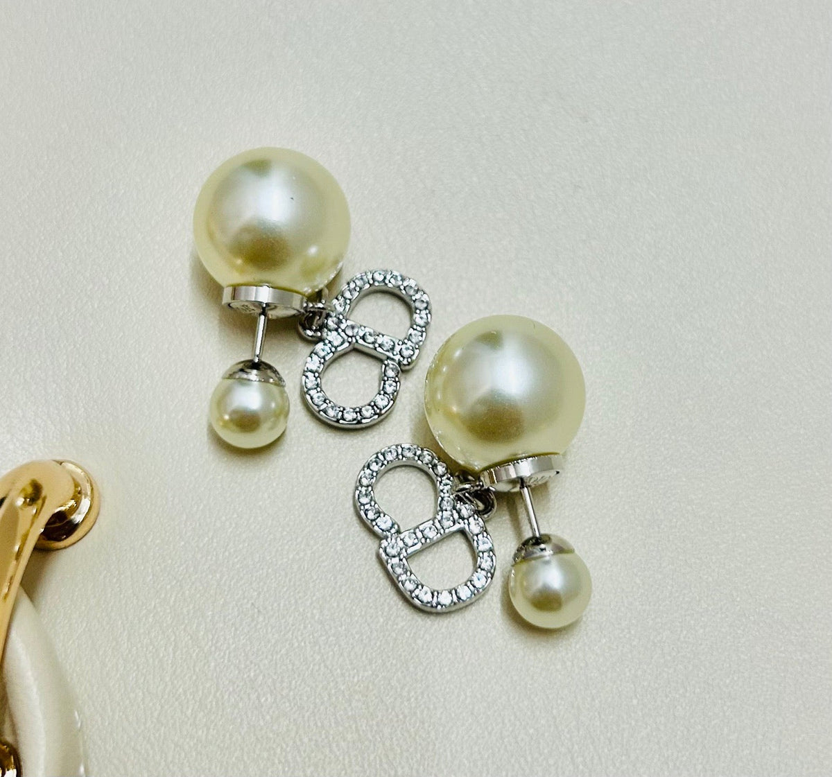Martin Graham earrings in polished metal-tone – front view