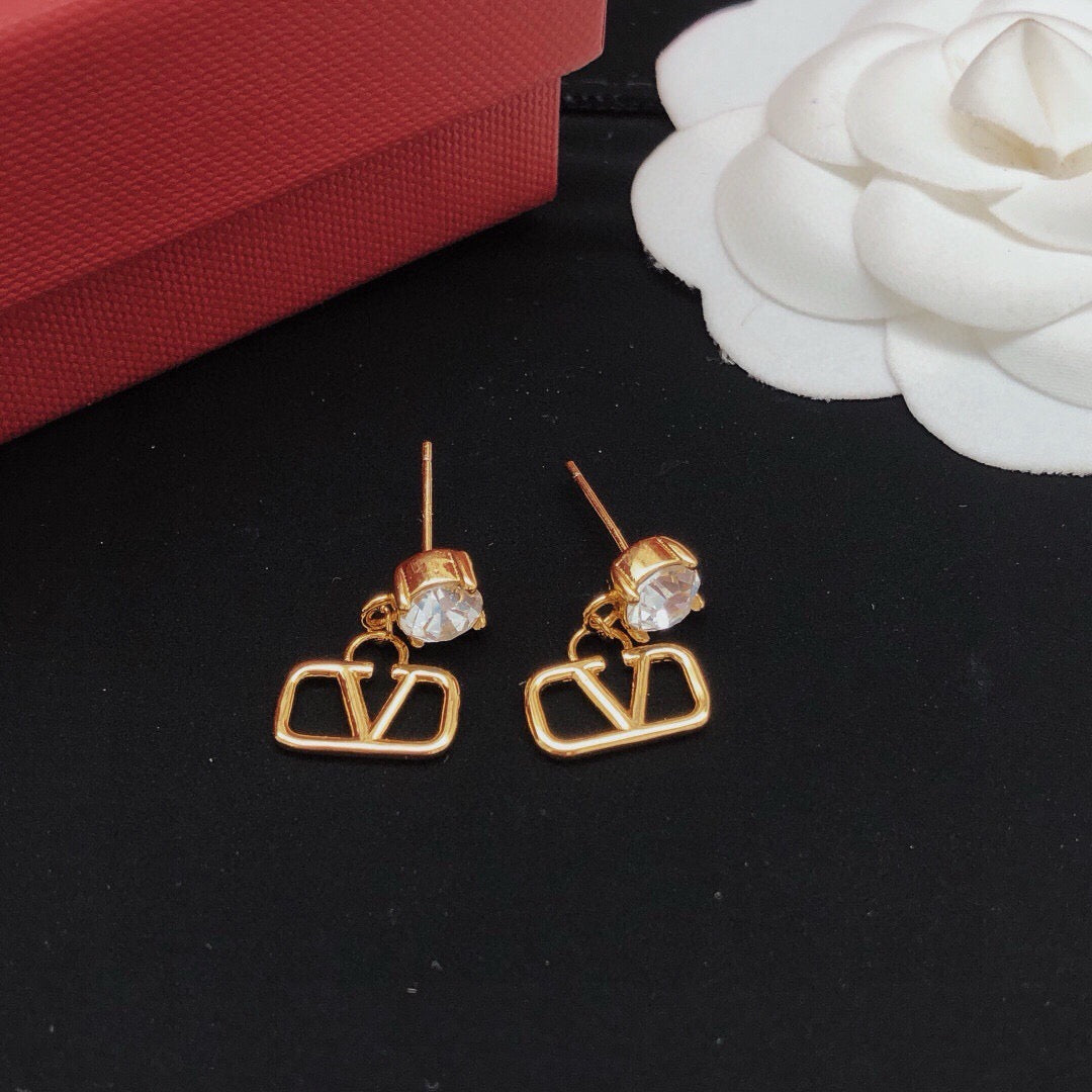 Martin Graham stud earrings in polished metal-tone – front view