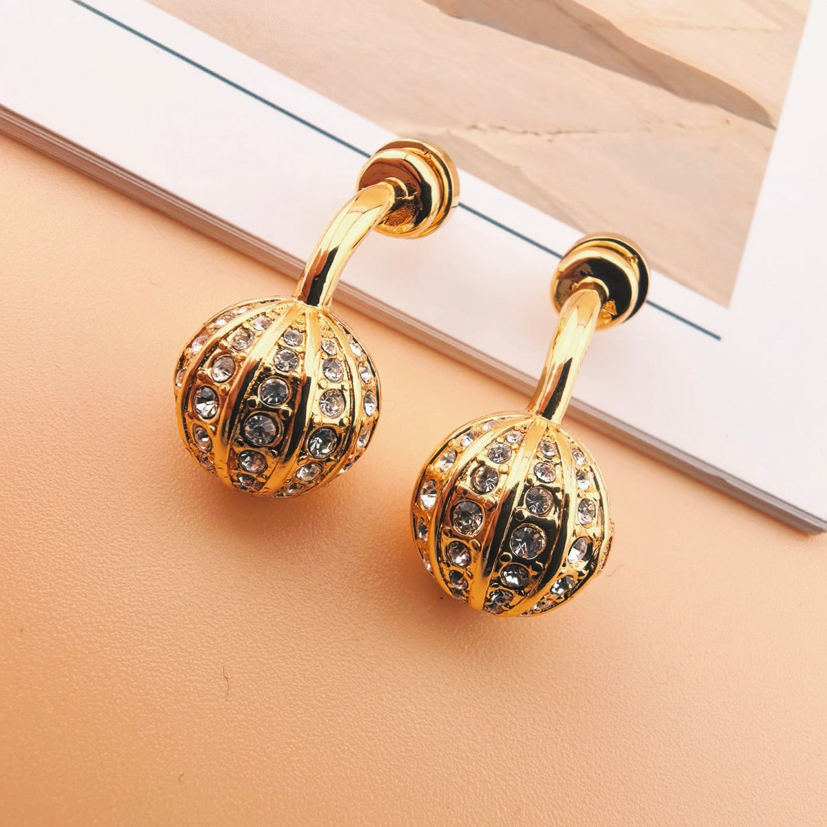 Martin Graham earrings in polished metal-tone – front view