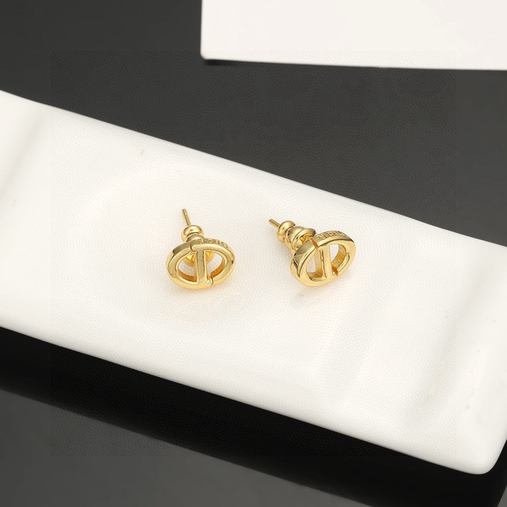 Martin Graham stud earrings in polished metal-tone – front view