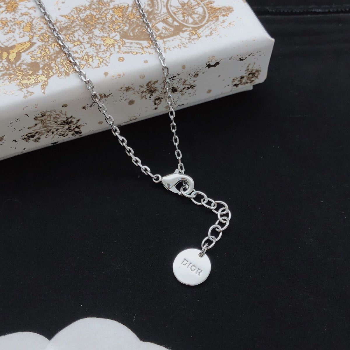 Martin Graham pendant necklace in polished metal-tone – front view