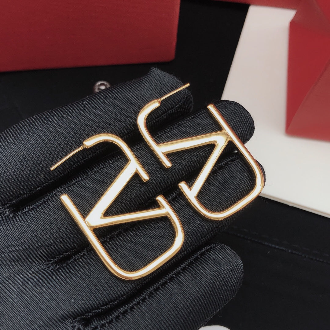Martin Graham stud earrings in polished metal-tone – front view