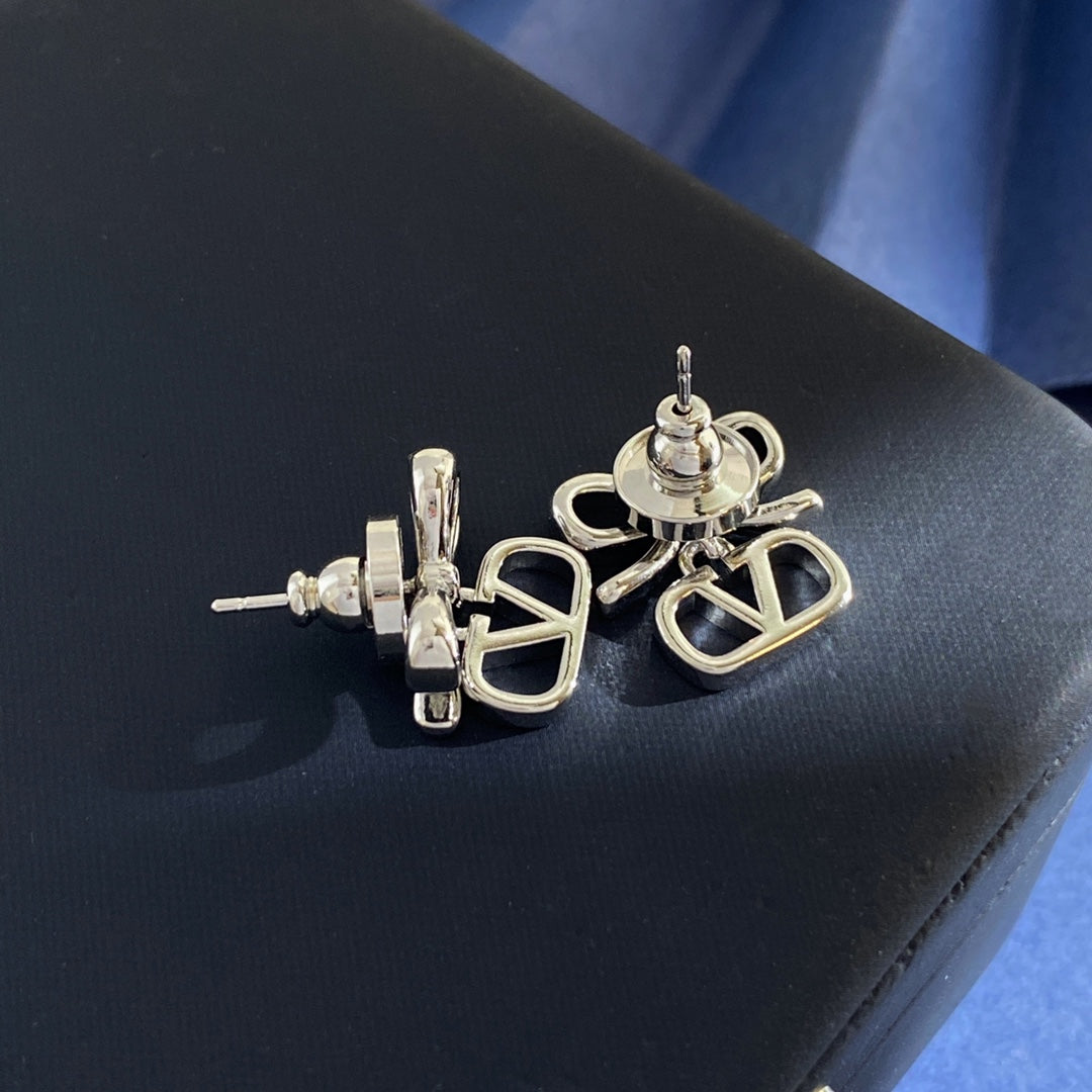 Martin Graham stud earrings in polished metal-tone – front view