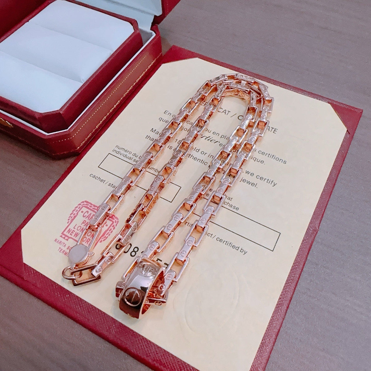 Martin Graham pendant necklace in polished metal-tone – front view