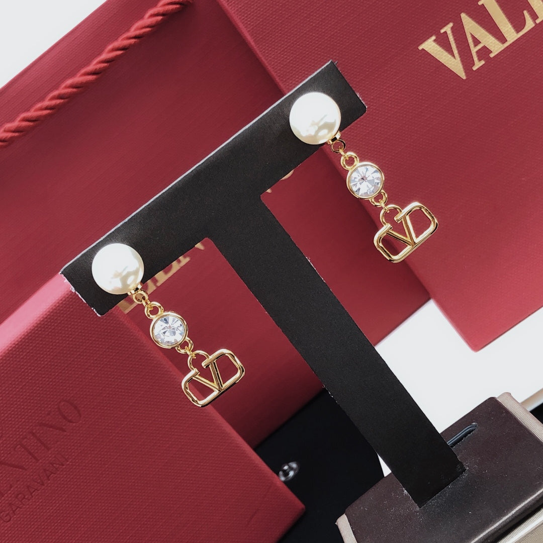 Martin Graham stud earrings in polished metal-tone – front view