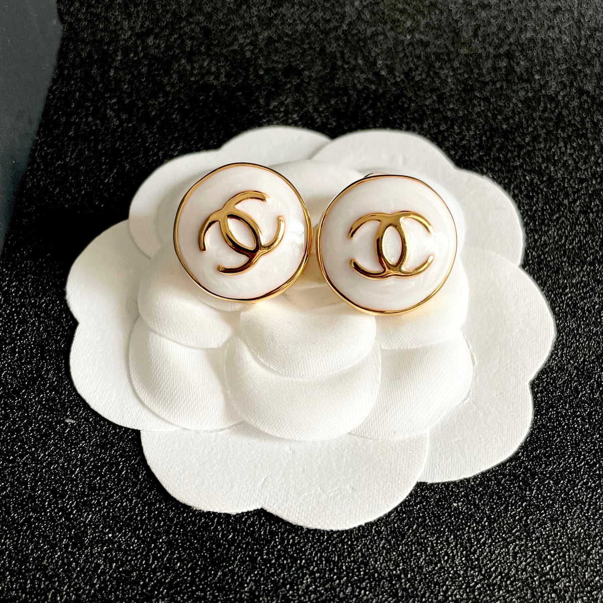 Martin Graham stud earrings in polished metal-tone – front product view