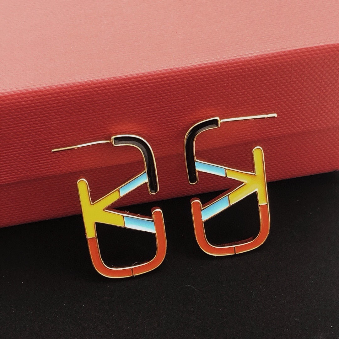 Martin Graham stud earrings in polished metal-tone – front view