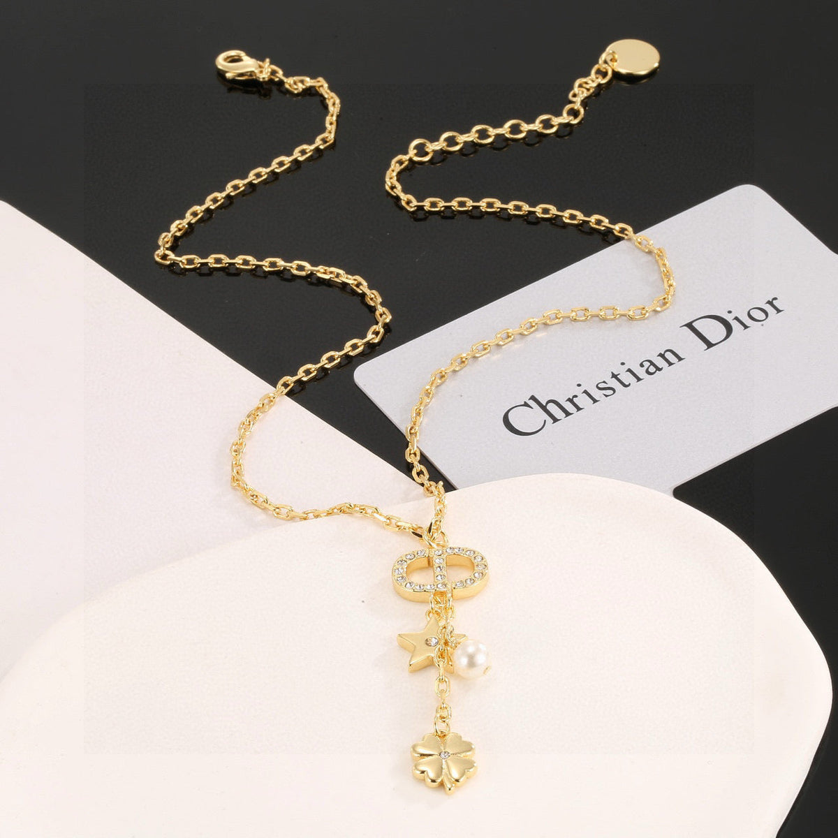 Martin Graham pendant necklace in polished metal-tone – front view
