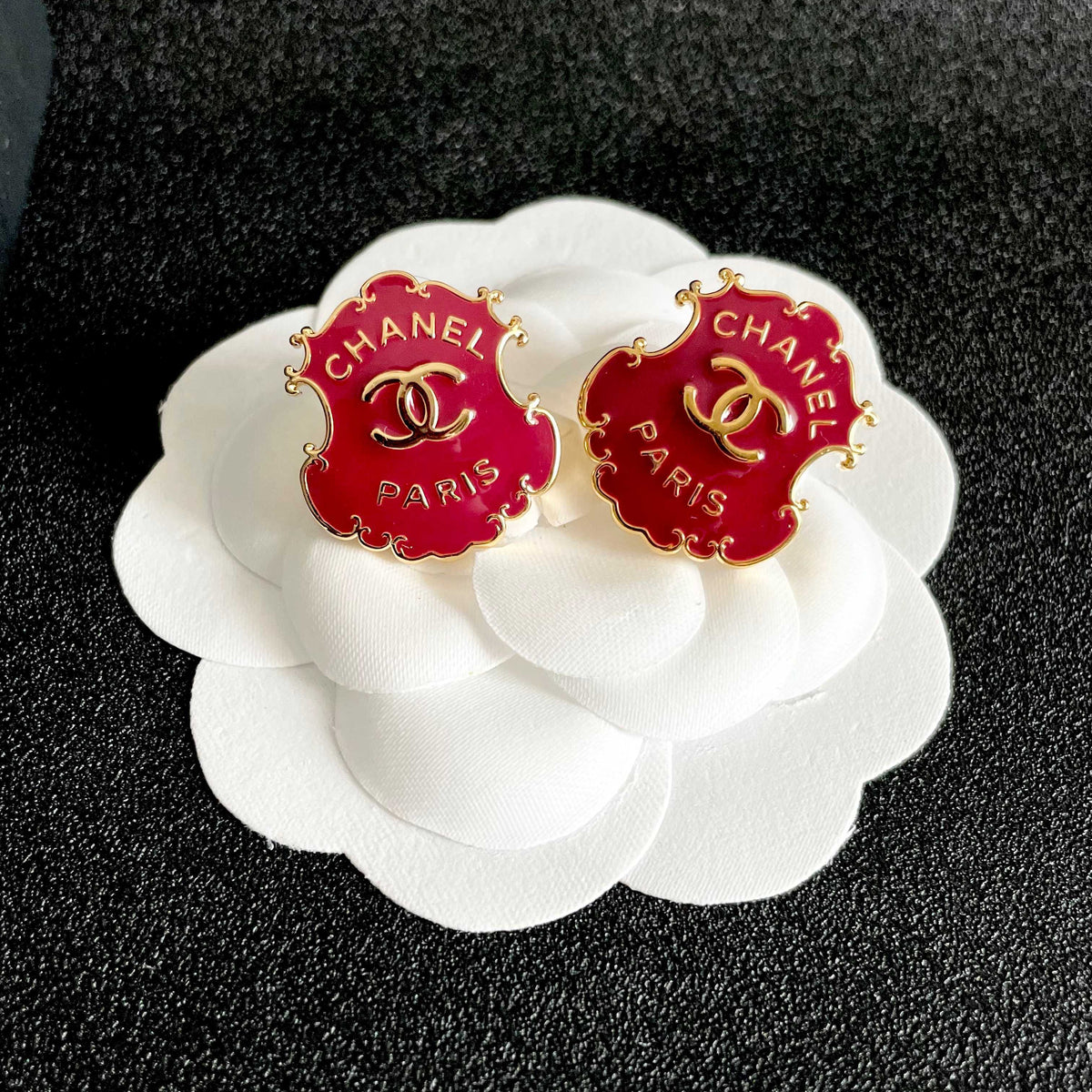 Martin Graham stud earrings in polished metal-tone – front product view