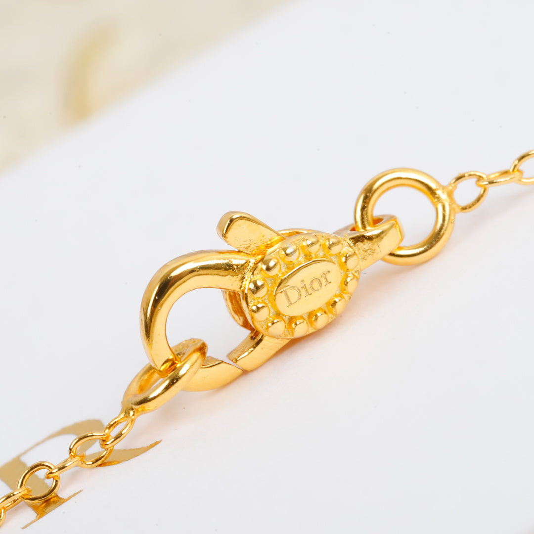 Martin Graham pendant necklace in polished metal-tone – front view