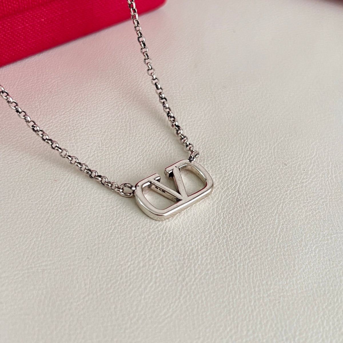 Martin Graham pendant necklace in polished metal-tone – front view