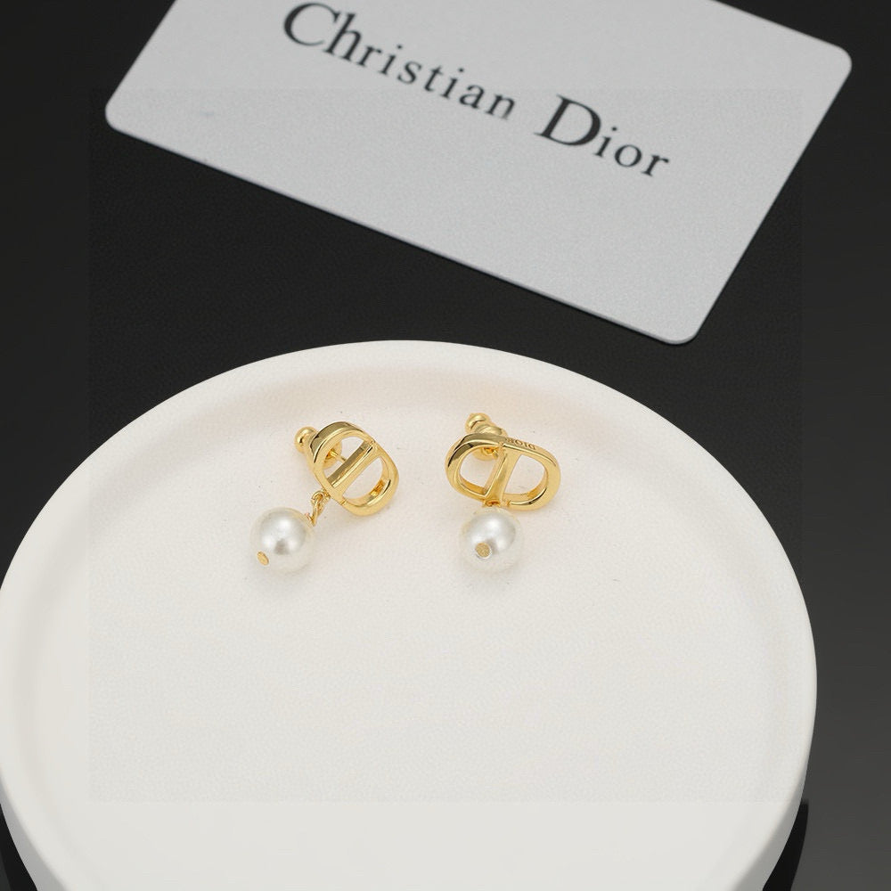 Martin Graham stud earrings in polished metal-tone – front view