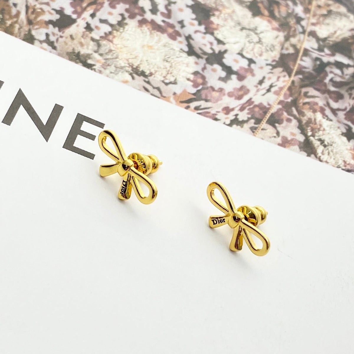 Martin Graham stud earrings in polished metal-tone – front view